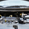 Car engine close-up. Close up of car parts under the hood after maintenance and washing