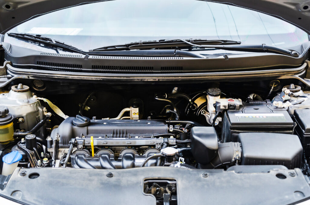 Car engine close-up. Close up of car parts under the hood after maintenance and washing