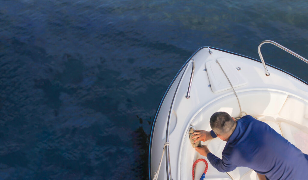 Sea fishing on a high-speed boat. Vacationers on a boat threw fishing rods into the sea in the evening at sunset.