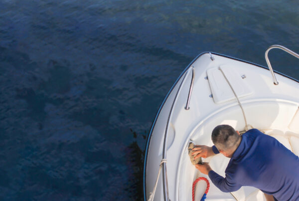 Sea fishing on a high-speed boat. Vacationers on a boat threw fishing rods into the sea in the evening at sunset.
