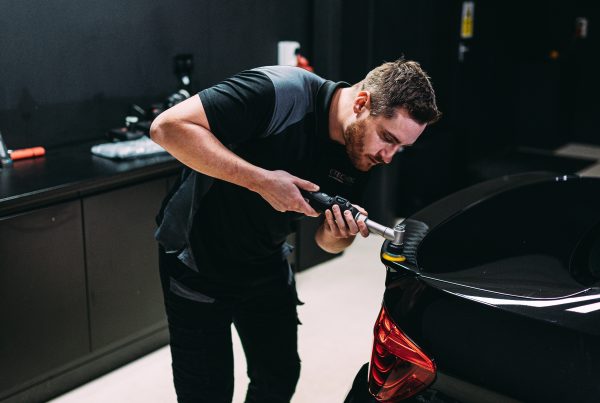 Man correcting paint on a car